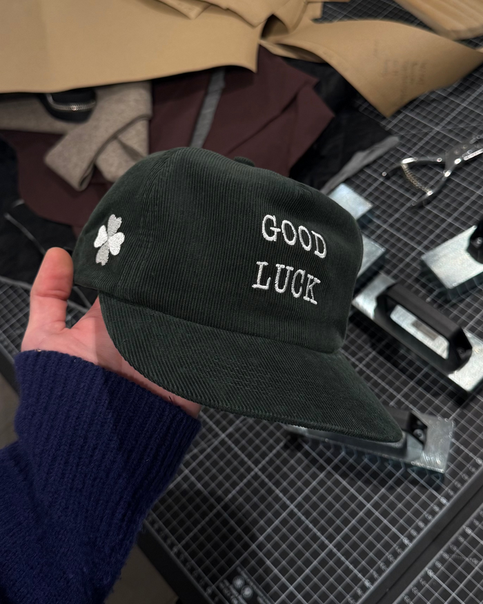 Green cap with clover and Good Luck text, adjustable baseball cap