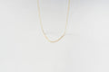 The Adelene Paperclip Chain by LLUME Jewelry features delicate gold-plated oval links, elegantly displayed against a plain white background.