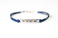 Bracelet with Hebrew text am Israel chai עם ישראל חי on a white background