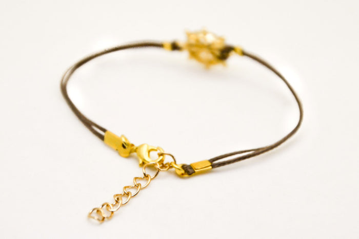 Brown cord bracelet with a 14k gold plated Ship wheel charm - shani-adi-jewerly