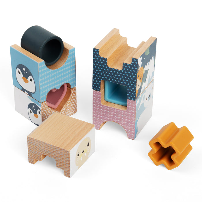 Wooden toy blocks with animal designs on a white background