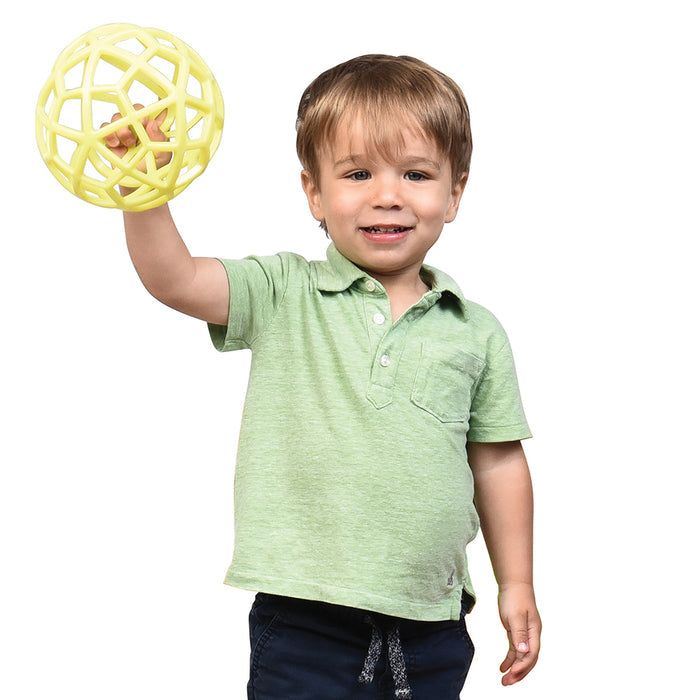 Kid holding yellow lattice ball on white background