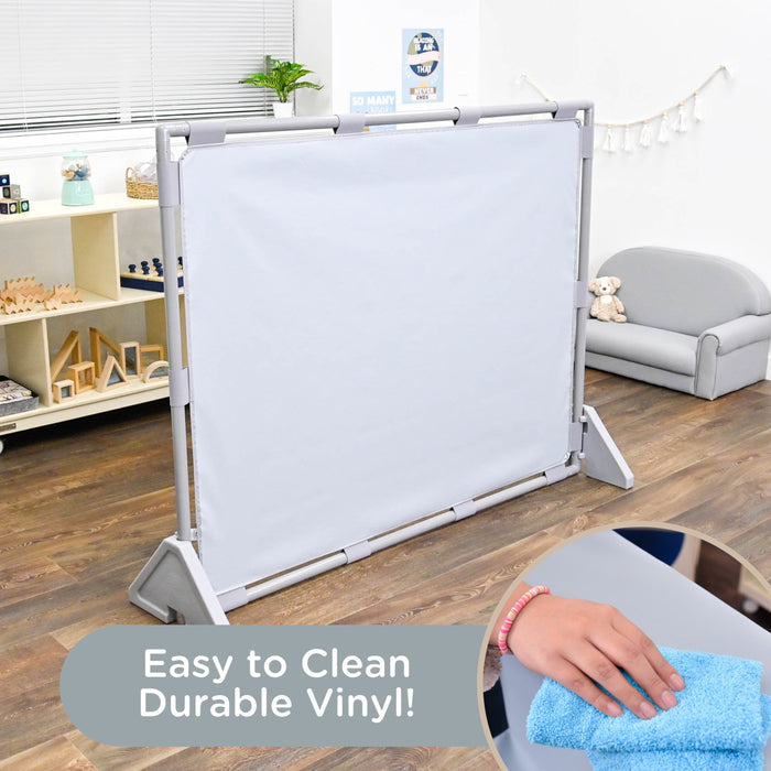 Room divider with white vinyl panel in a room with furniture and decor.