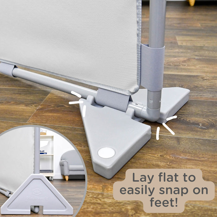 Gray divider with adjustable footrest on a wooden floor, showing how to lay flat and snap on feet.