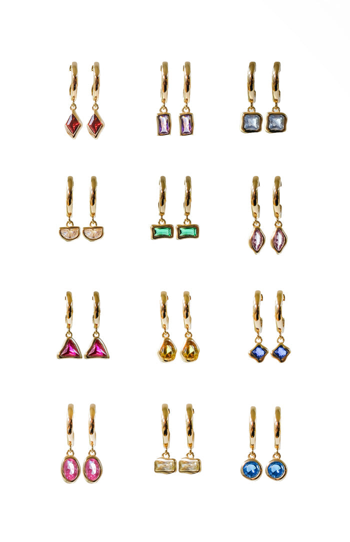 A display of twelve pairs of LLUME Jewelry Birthstone Earrings—gold plated with assorted gemstone colors—arranged in a four-by-three grid on a white background. Ideal as personalized jewelry or for celebrating birthstones.