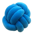 Blue knot-shaped pillow on a white background