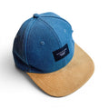 Watershed blue and tan six panel snapback cap with woven front patch and flat peak.
