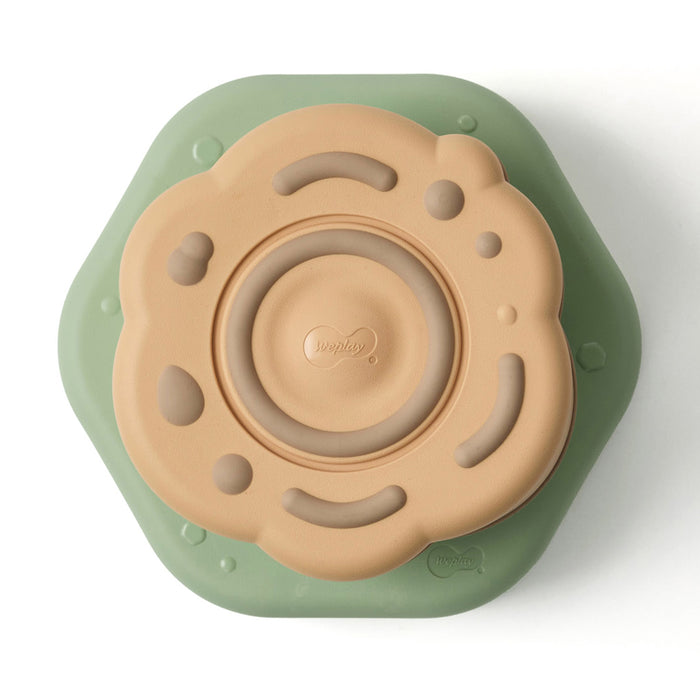 Children's stepping stone with green base and brown top on a white background