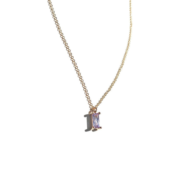 The Celia Necklace by LLUME Jewelry showcases a rectangular lilac gemstone pendant in a minimalist gold vermeil setting, photographed against a white background.