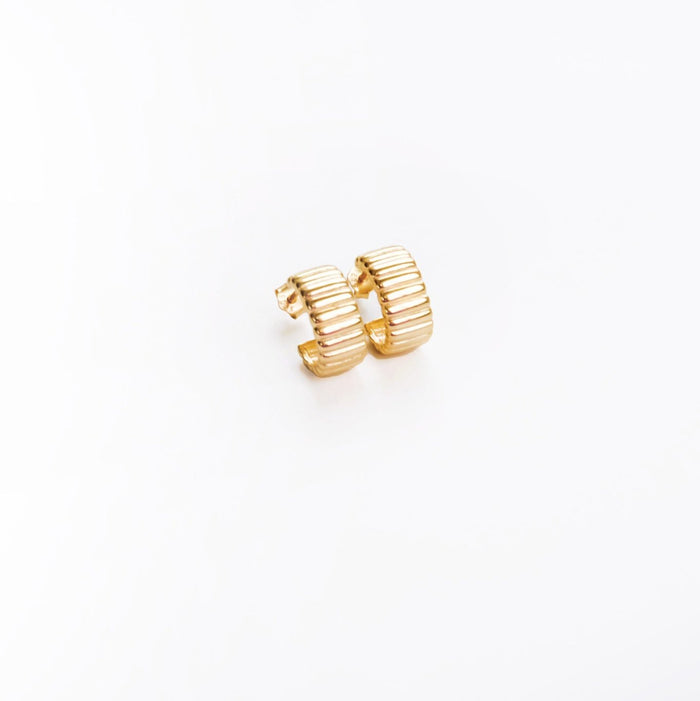 The Chloe Hoops by LLUME Jewelry are small, vintage-inspired gold hoop earrings with a ribbed design and 18k gold plated finish, shown on a white background.