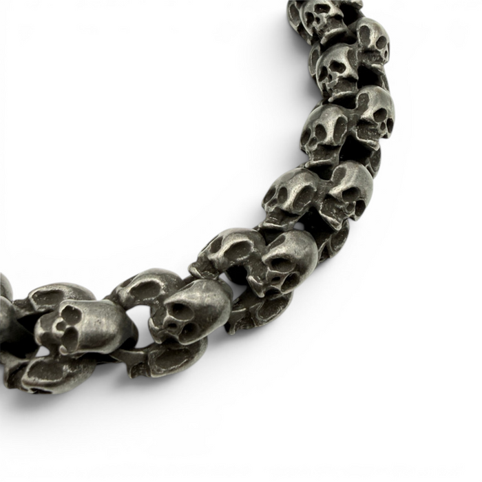 Close up of oxidised skull bracelet showing textured skull link detail