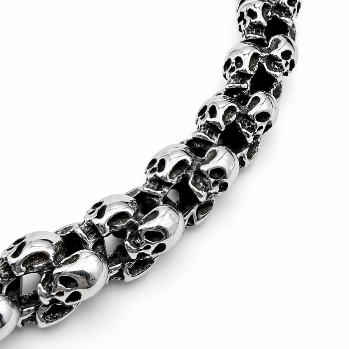 Close up angled view of chunky polished skull bracelet showing skull link detail