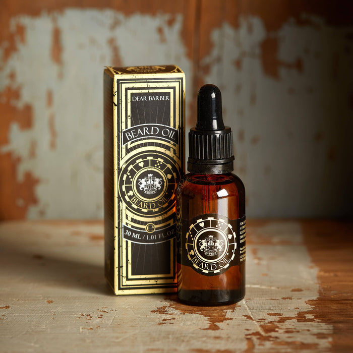 Beard oil bottle with packaging on rustic background