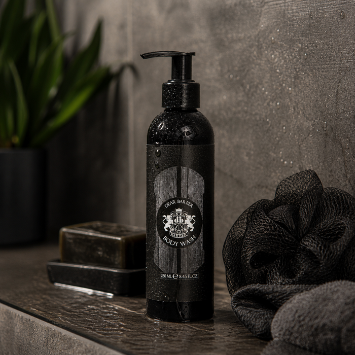 Dear Barber Body Wash 250ml in moody bathroom lifestyle setting with grooming accessories