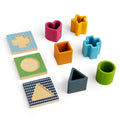 Set of colorful shape sorting toys on a white background