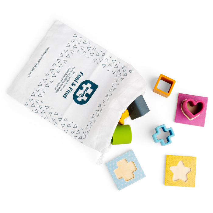 Colorful wooden shape blocks and packaging on a white background