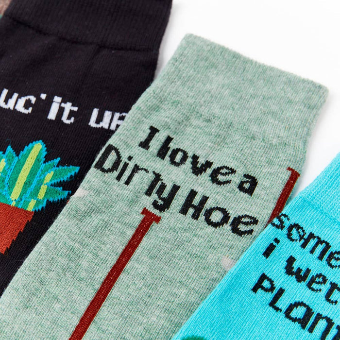 close up of gardening themed socks with tools and plant designs