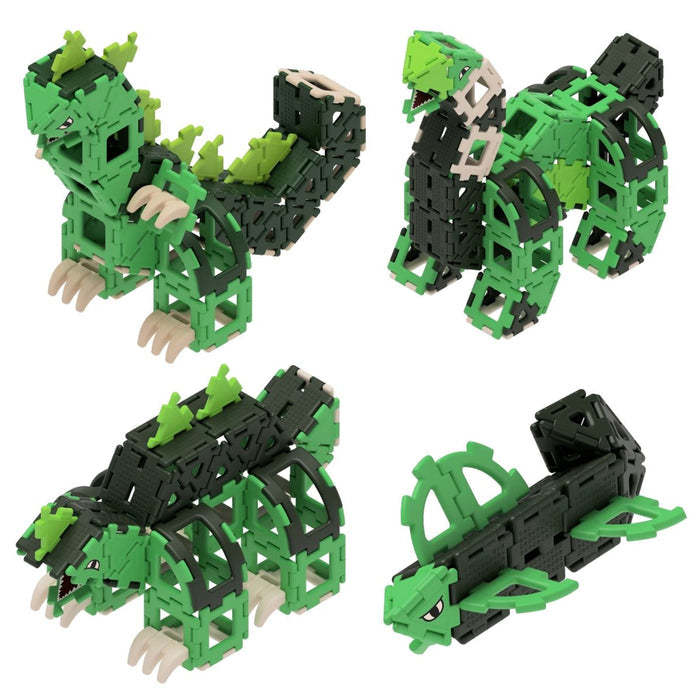 Set of green and black building block models on a white background