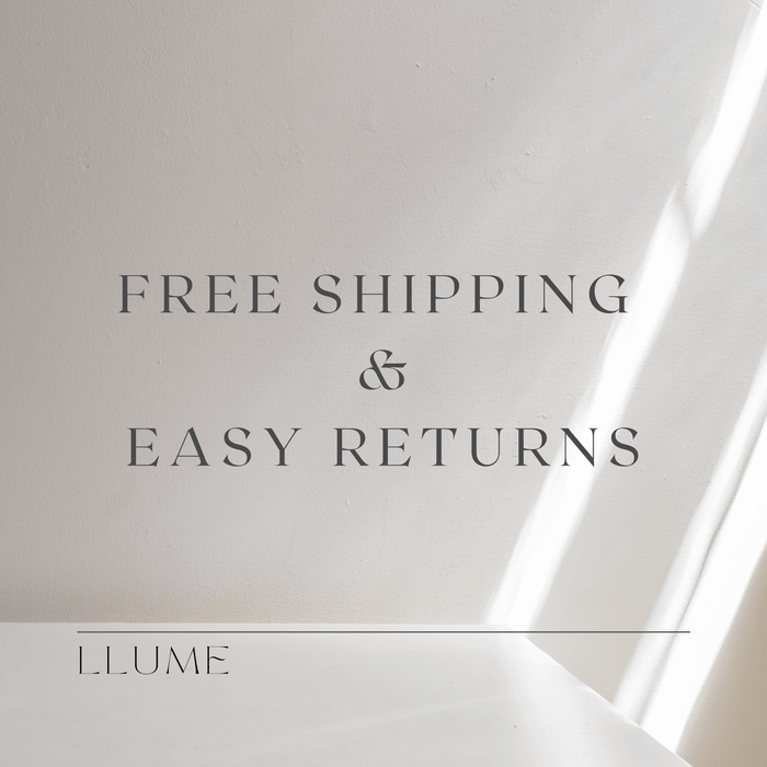 Text on a light beige background reads: FREE SHIPPING & EASY RETURNS. LLUME Jewelry is written below a horizontal line. Sunlight casts soft diagonal shadows, highlighting the Harlow Chain from our 18k gold filled necklace collection.