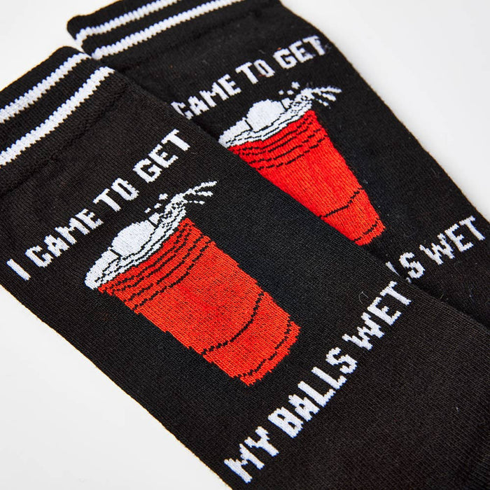 close up of I Came To Get My Balls Wet socks showing pint design and text