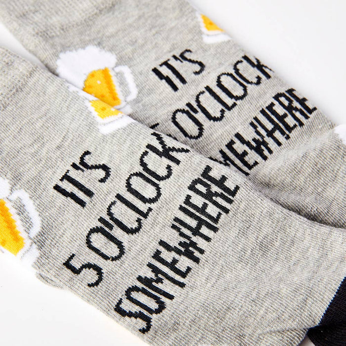 close up of it’s 5 o’clock somewhere slogan on socks