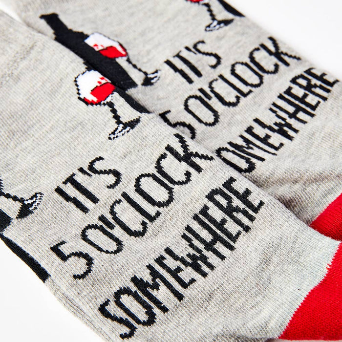 close up of it’s 5 o’clock somewhere slogan on wine themed socks