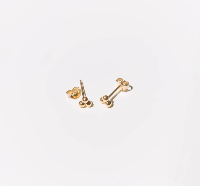 The June Studs by LLUME Jewelry are minimalist earrings made from gold plated sterling silver, featuring three round clusters and shown on a plain white background.