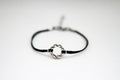 Karma bracelet, silver braided circle charm and black string, yoga jewelry - shani-adi-jewerly