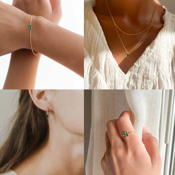 A collage of four images shows LLUME Jewelry’s Kismet Capsule set—gold bracelet, necklace, earrings, and ring with rectangular green stones—layered effortlessly by women in neutral outfits with light skin tones.