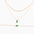 The Kismet Starter Set by LLUME Jewelry features three delicate gold chains—two with rectangular green gemstone pendants and one plain—displayed on a white background, ideal for minimalist layering and stacking.