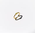 The Limon Ring by LLUME Jewelry, a gold-plated 925 sterling silver piece featuring a textured band and lemon yellow gemstone, is shown on a white background with a soft shadow to the lower right.