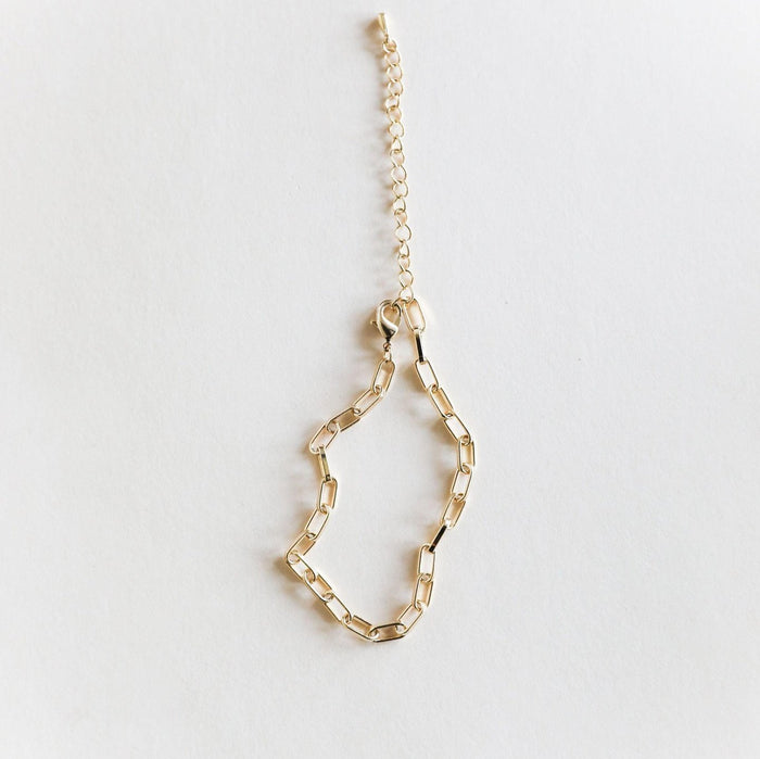 The LLUME Jewelry Link Chain Bracelet features elongated rectangular gold-plated links and an adjustable extension chain, shown on a white background.
