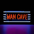 Front view of Man Cave neon sign glowing in blue and red lighting