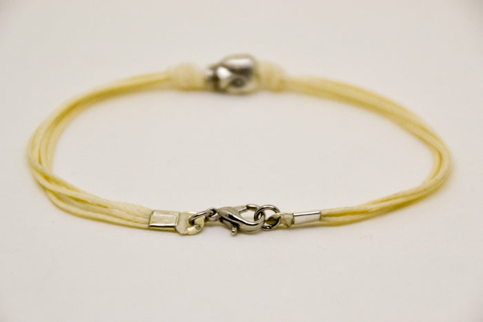 Silver skull bracelet for men, beige cord - shani-adi-jewerly