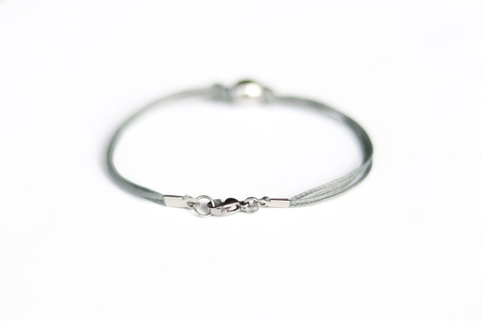 Men's bracelet with silver bead charm and a gray cord - shani-adi-jewerly
