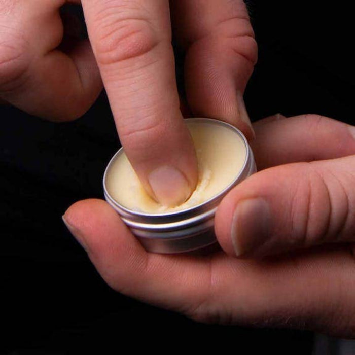 Applying Mo Bros beard balm from the beard care gift set