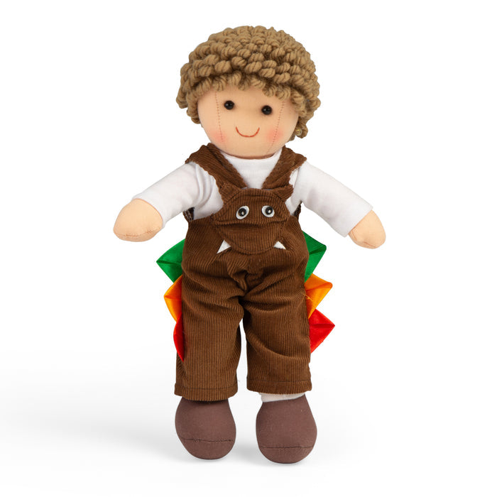 Doll wearing brown overalls on a white background