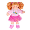 Toy doll with red hair in pigtails wearing a pink dress with a flower design on a white background