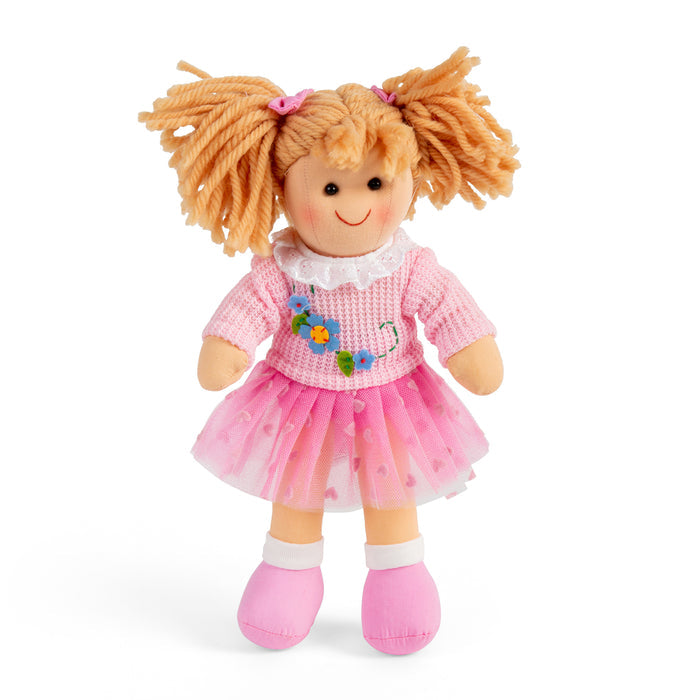 Toy doll with blonde hair, pink dress, and flower design on a white background