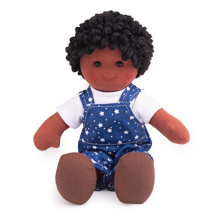 Plush toy with dark skin, black hair, wearing a blue star-patterned romper on a white background