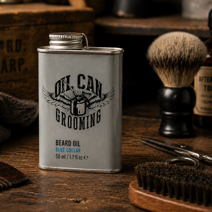 Blue Collar beard oil 50ml on wooden workbench with grooming tools in warm natural setting