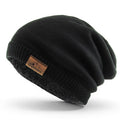 Black oversized slouch beanie with sherpa fleece lining and relaxed fit styling.