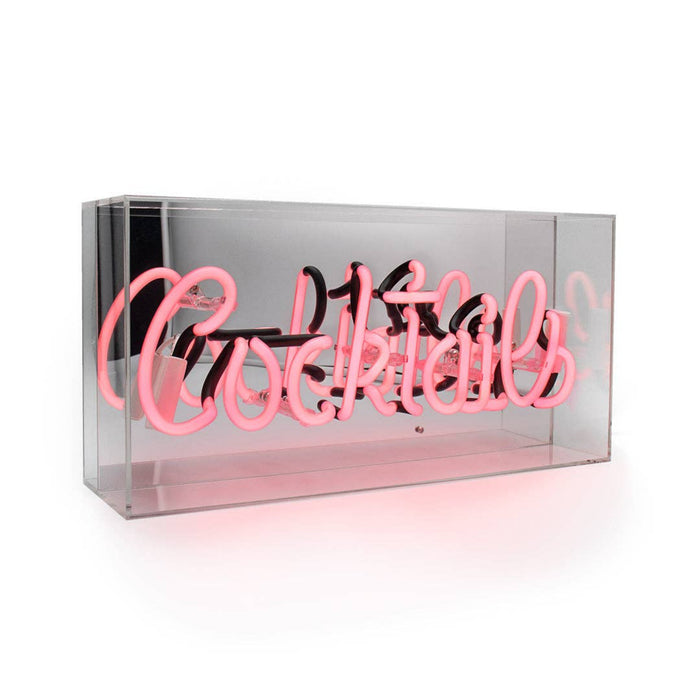 Angled side view of the pink Cocktails glass neon sign inside a transparent acrylic display box