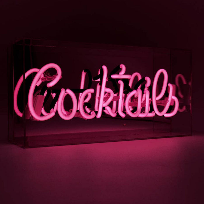 Close up of the illuminated pink Cocktails glass neon sign with retro style neon tubing