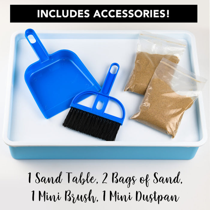 Sand table set with blue mini brush and dustpan, two bags of sand, on a white tray.