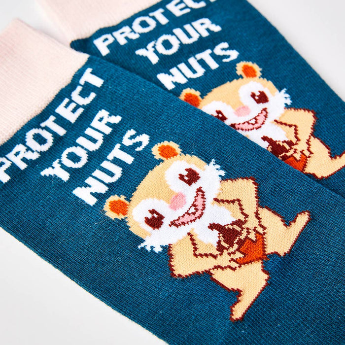 close up of Protect Your Nuts socks showing squirrel design and text