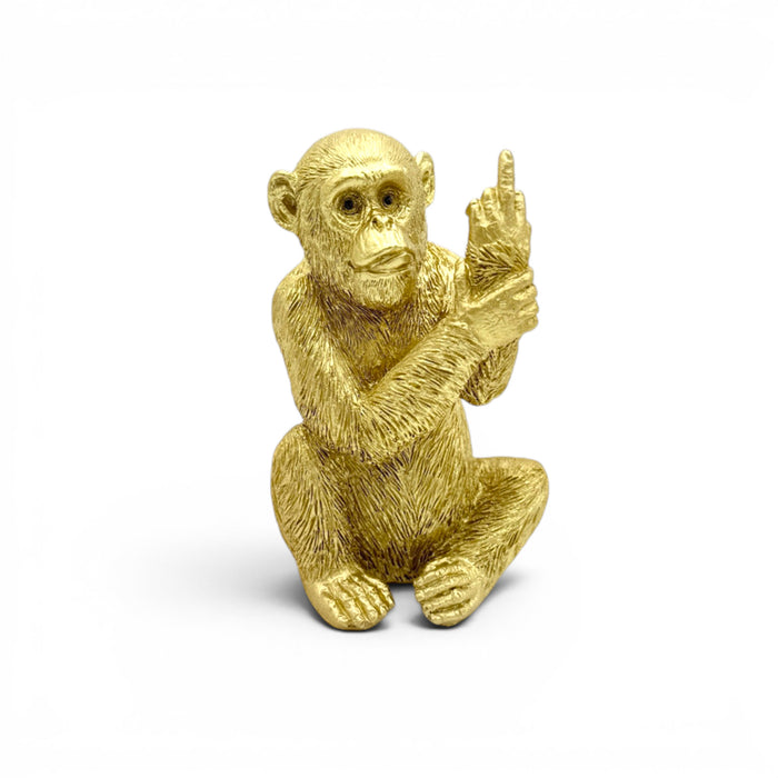 Mmall golden resin monkey with middle finger on white background
