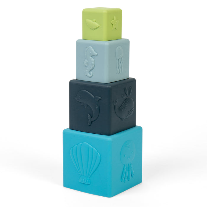 Stack of four colorful blocks with embossed designs on a white background