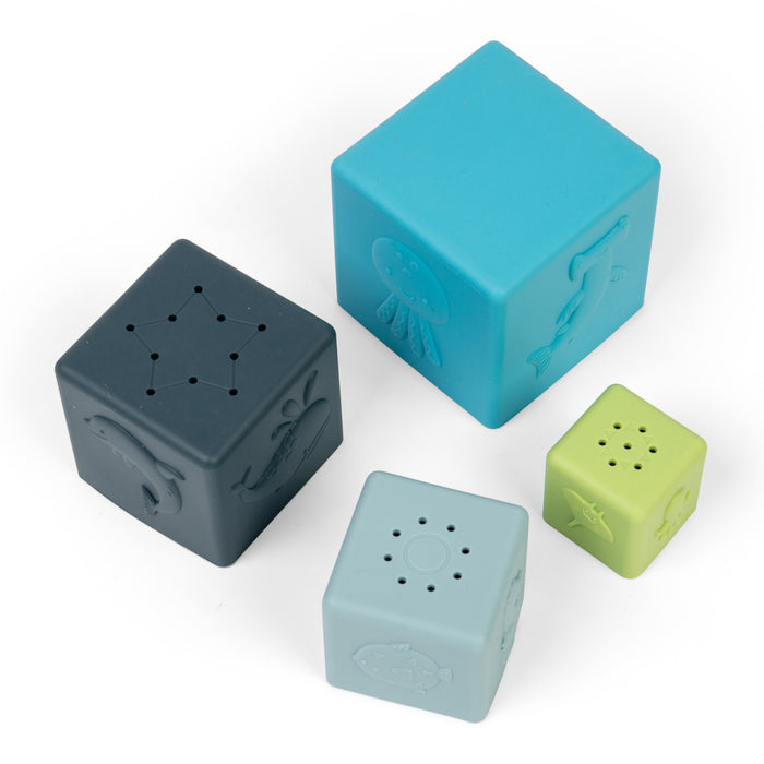 Four colorful cube-shaped objects on a white background