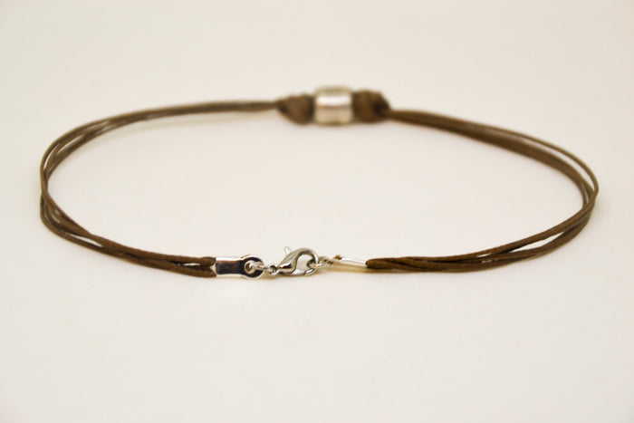 Men's anklet with a silver tube charm and a brown cord - shani-adi-jewerly